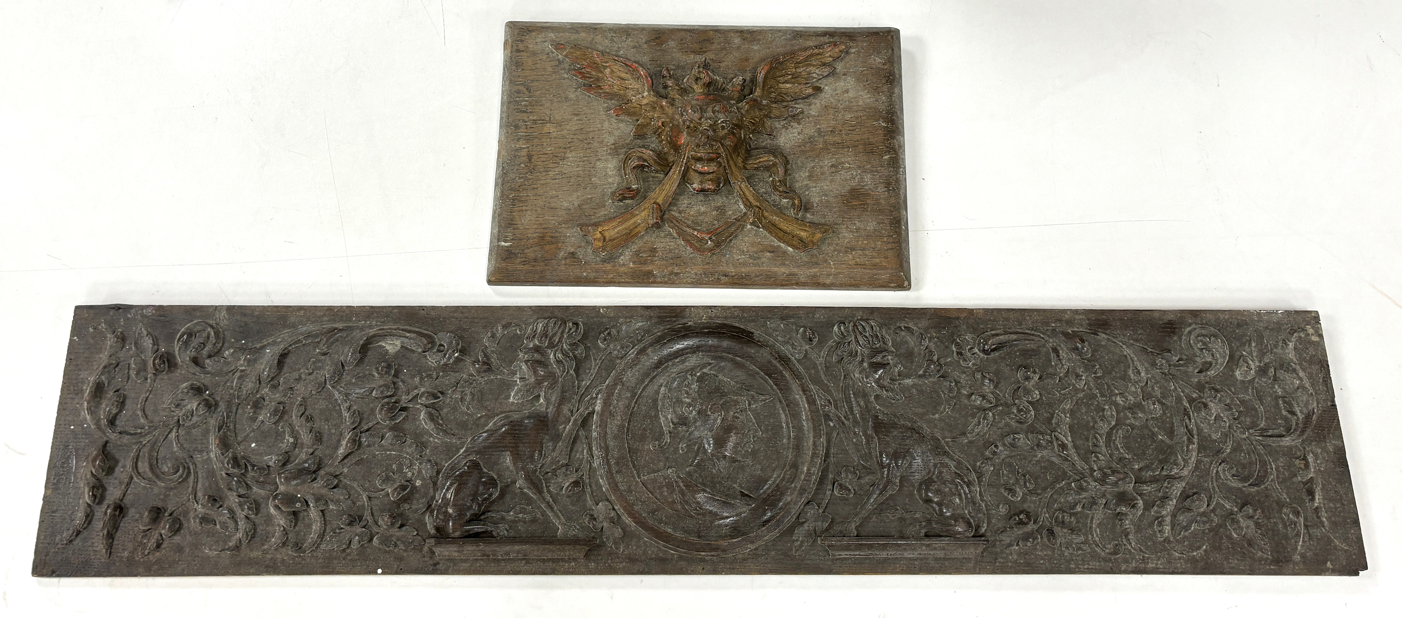 Two 18th century carved oak panels, largest 93cm wide